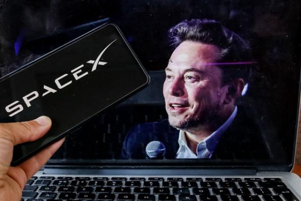 Analysis: Musk's empire closes in on…