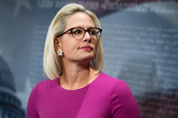 photo of Kyrsten Sinema is reportedly threatening to hold Biden's agenda hostage. She wants to pass the bipartisan… image