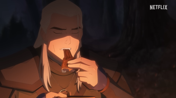 Geralt broods by the campfire in the…