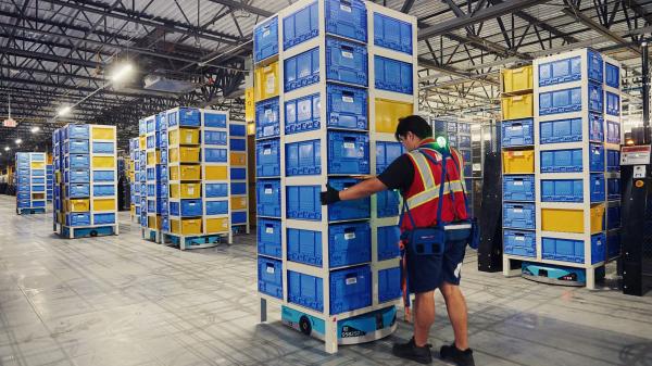 photo of Inside Amazon’s robotic arms race and what it means for the future of human work image