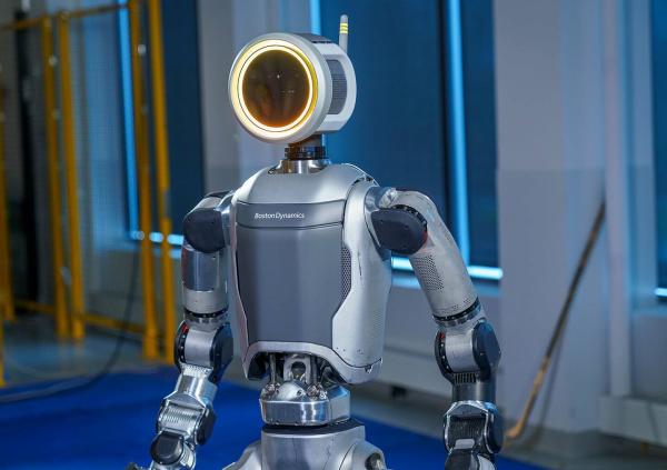 photo of Oh, what a feeling: Toyota building robots that get better with practice image