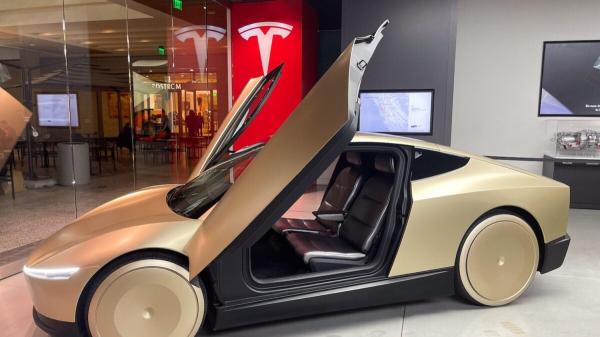 With Tesla Revenue and Profits Down,…