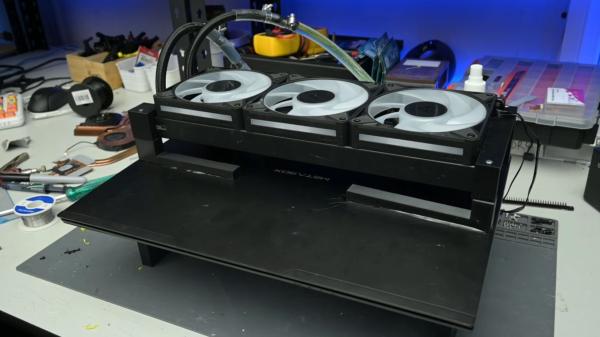 photo of Crazed modder straps 360mm AIO radiator to laptop, cuts temps to below 40 degrees image
