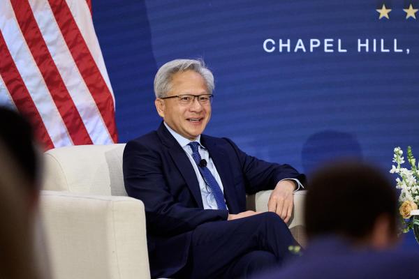 photo of Jensen Huang puts Trump on speakerphone onstage to announce robots won’t take over the world image