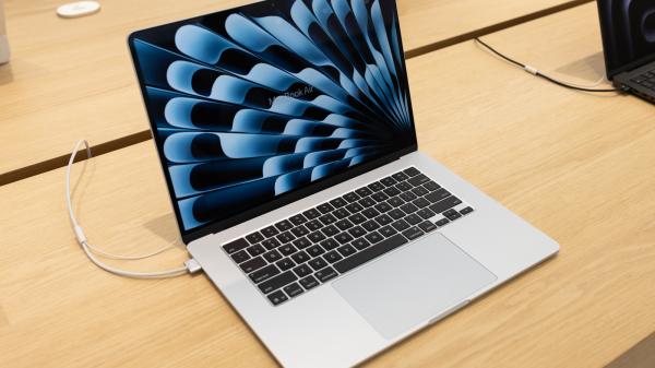 photo of How does using your MacBook while charging affect its battery life? image