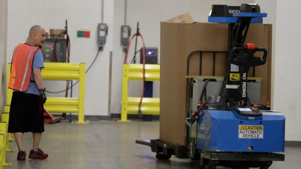photo of Amazon Is Rolling Out a 'Robotic Tech Vest' to Keep Workers From Getting Hit by Robots image