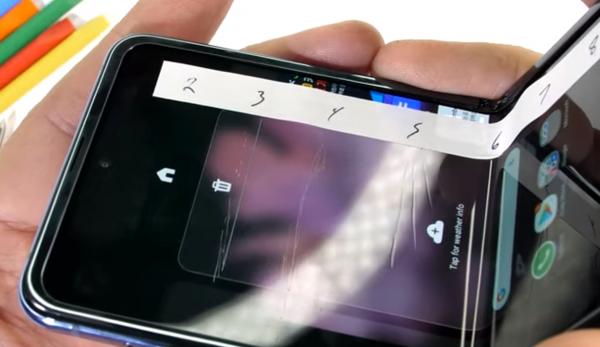 photo of JerryRigEverything says the Samsung Galaxy Z Flip uses Fake Glass image