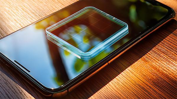 photo of A smartphone that can charge itself from sunlight — scientists have created transparent solar cells that can be… image